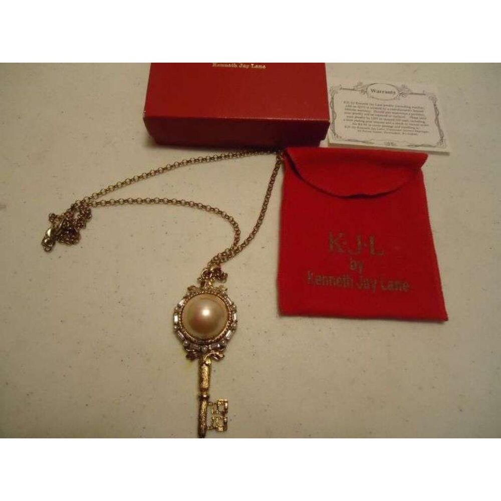 Kenneth Jay Lane Signed, Gold Tone Necklace Featuring a Large Key-Shaped Pendant